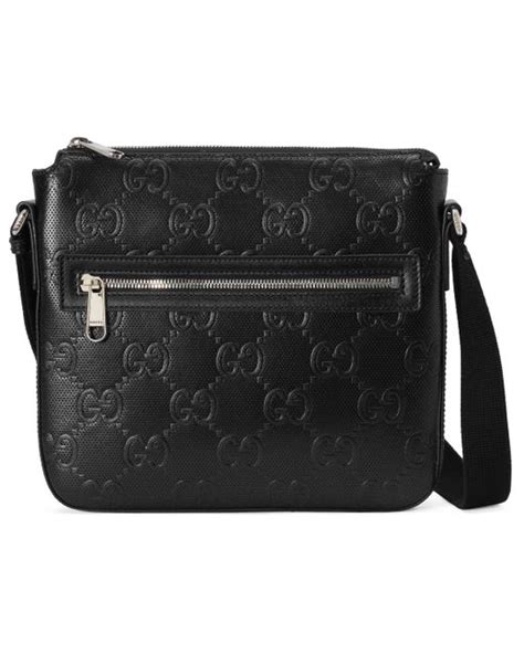 GG embossed small messenger bag in black leather 